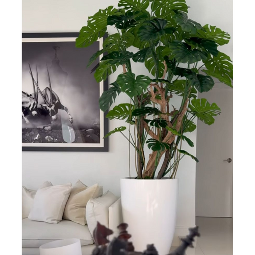 Monstera artificial en maceta blanca de alto brillo