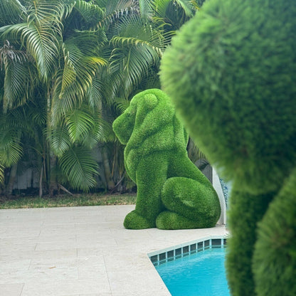 León sentado de pasto artificial – Figura topiaria